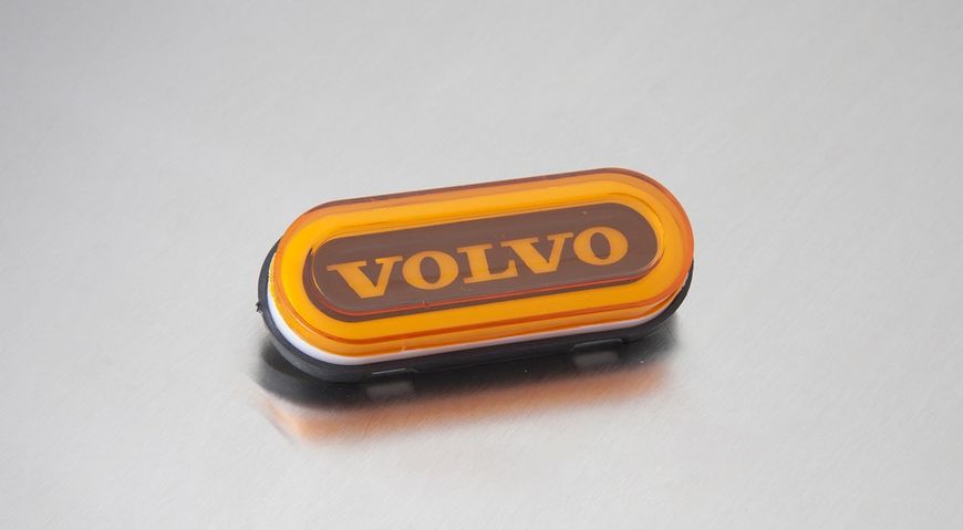 Фонарь габаритный овал НЕОН надпись "VOLVO" желтый MG101603 фото